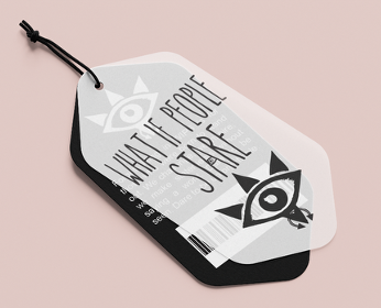 Branded hang tag with layered tags in black and translucent white, featuring the bold phrase 'WHAT IF PEOPLE STARE' and a stylised eye logo with geometric spikes and piercings on a soft pink background.